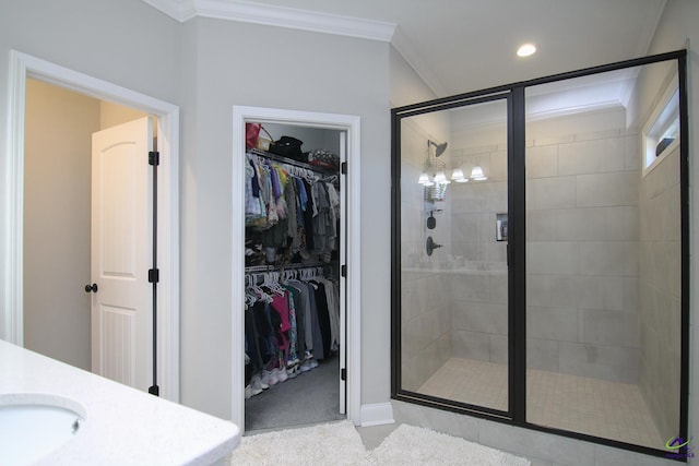 bathroom with vanity, crown molding, and walk in shower