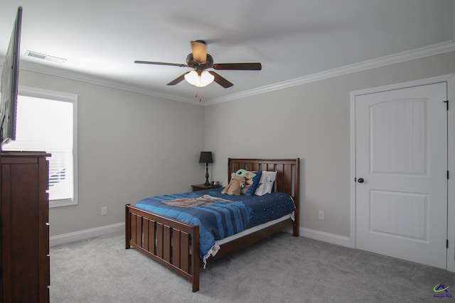 bedroom with ceiling fan, light colored carpet, and ornamental molding