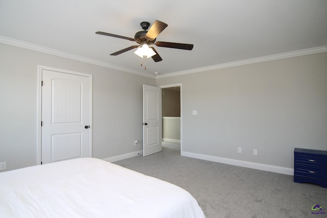 carpeted bedroom with ceiling fan and ornamental molding