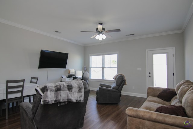 living room with dark wood-type flooring, ornamental molding, and ceiling fan