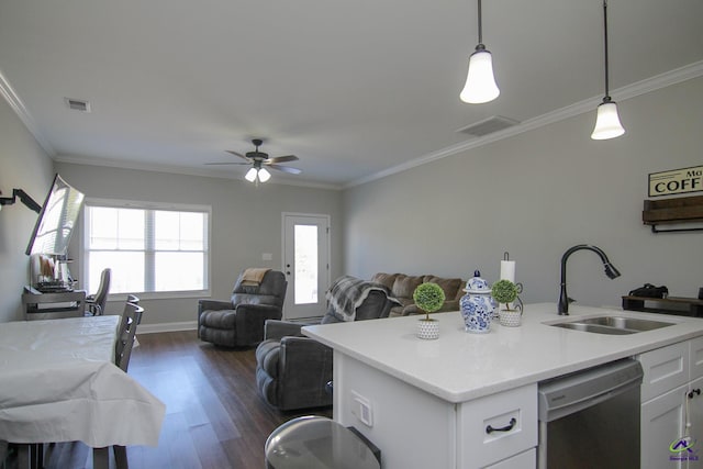 kitchen featuring an island with sink, dishwasher, hanging light fixtures, white cabinets, and sink