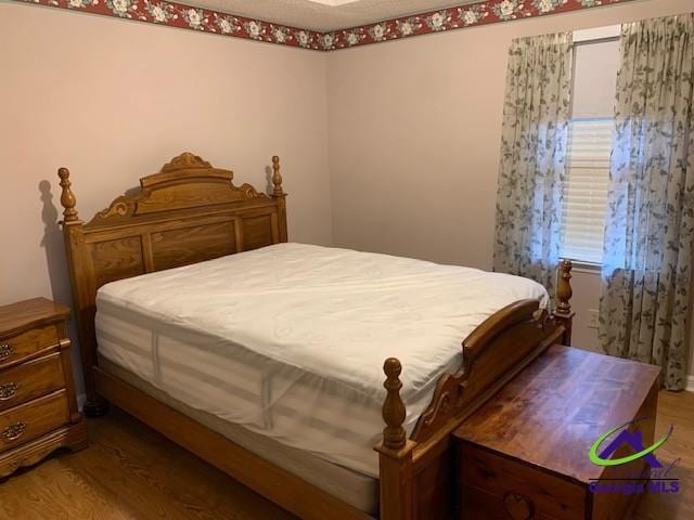 bedroom featuring hardwood / wood-style flooring