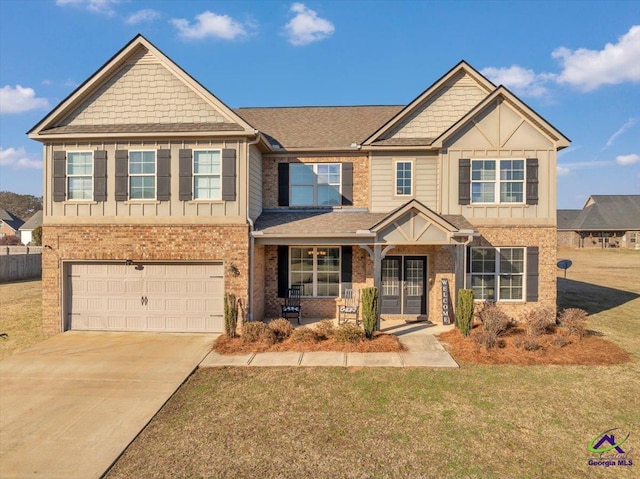 craftsman-style home with a front yard, a porch, and a garage