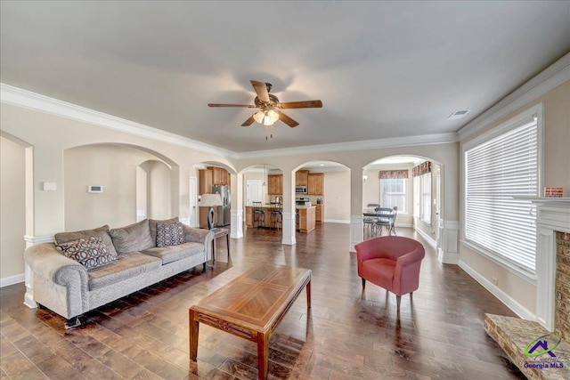 living room featuring dark hardwood / wood-style flooring and ornamental molding