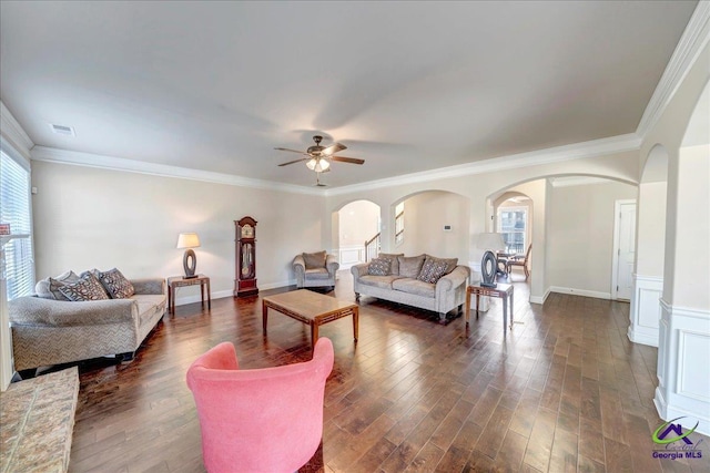 living room featuring ceiling fan, dark hardwood / wood-style flooring, and crown molding