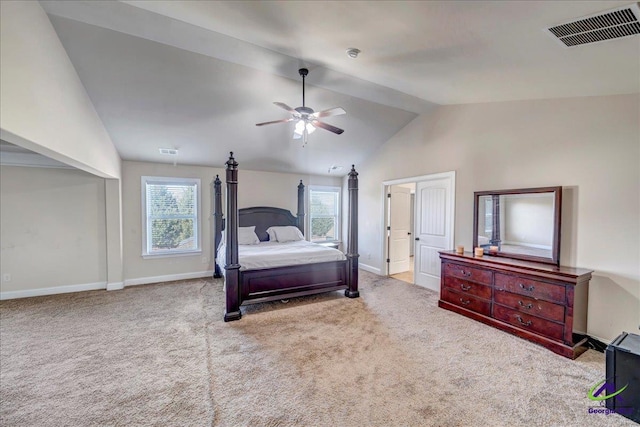 carpeted bedroom featuring ceiling fan, vaulted ceiling with beams, and multiple windows