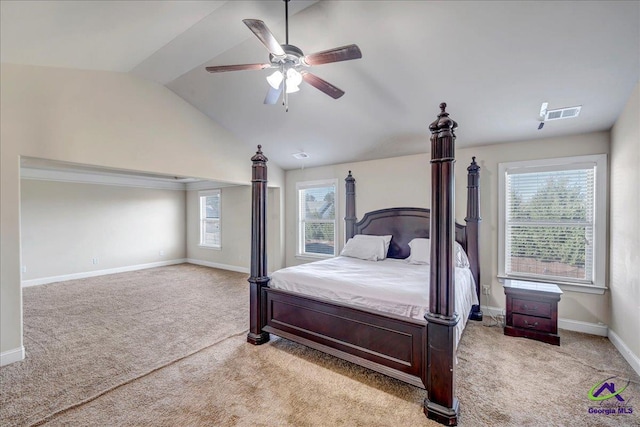 carpeted bedroom featuring ceiling fan and vaulted ceiling