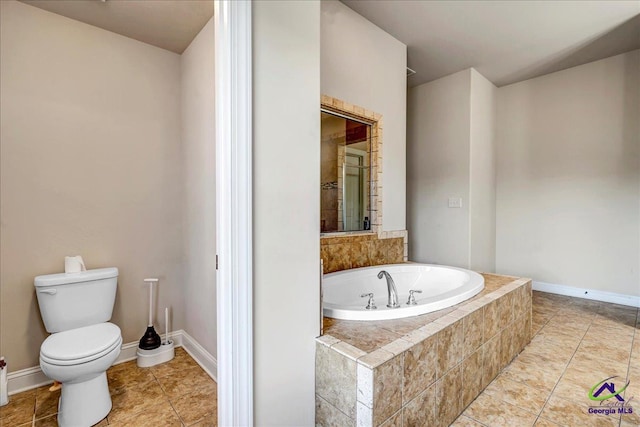 bathroom featuring toilet, tile patterned flooring, and a relaxing tiled tub