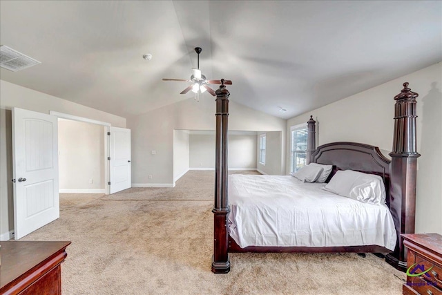 bedroom featuring light carpet, ceiling fan, and vaulted ceiling