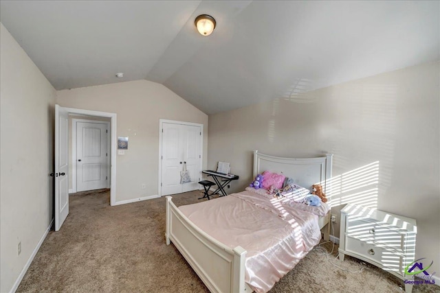 carpeted bedroom featuring a closet and lofted ceiling