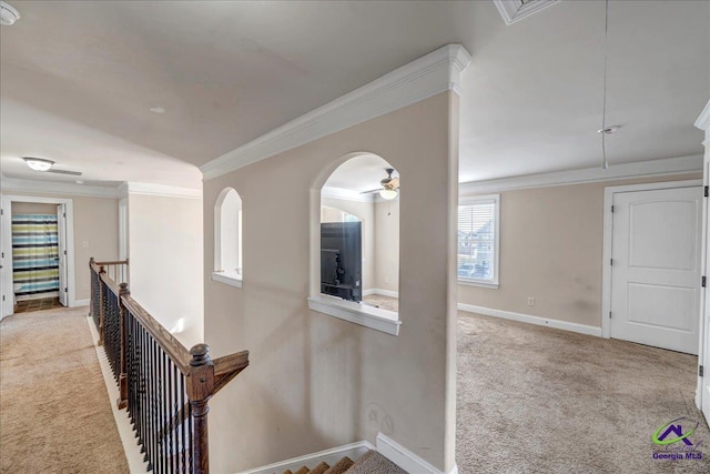 corridor with light carpet and crown molding