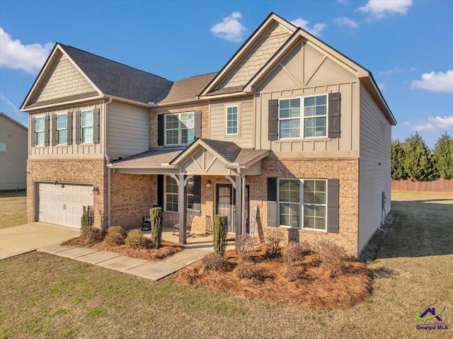 craftsman-style house featuring a front yard, a porch, and a garage