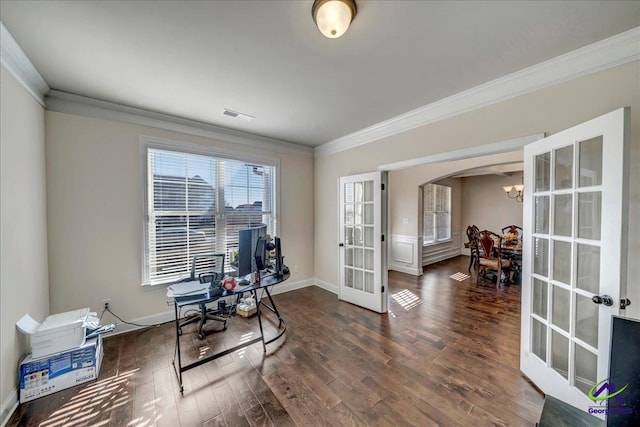 interior space with dark wood-type flooring, ornamental molding, french doors, and an inviting chandelier