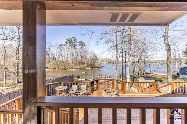 wooden terrace with a water view