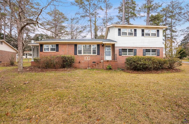 split level home featuring a front lawn