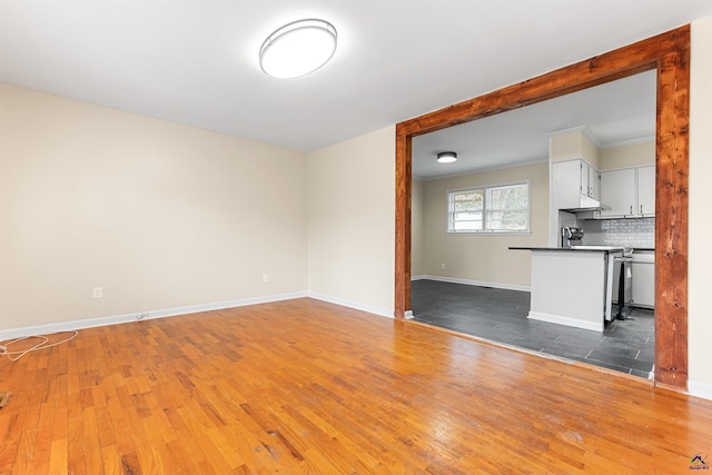 unfurnished living room featuring dark wood-type flooring