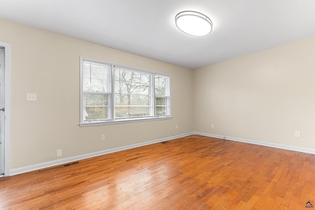 spare room with light wood-type flooring