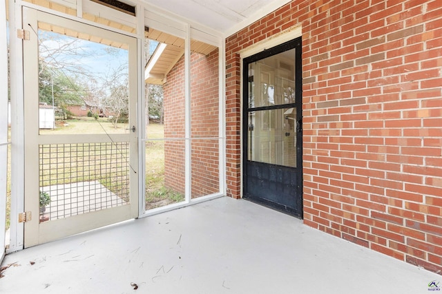 unfurnished sunroom featuring a wealth of natural light