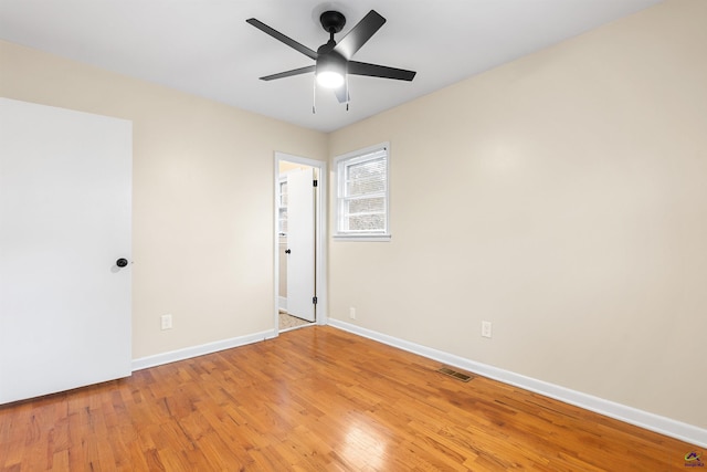 unfurnished room with ceiling fan and light hardwood / wood-style floors