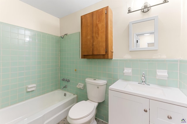 full bathroom with toilet, vanity, tile walls, tile patterned floors, and tiled shower / bath combo