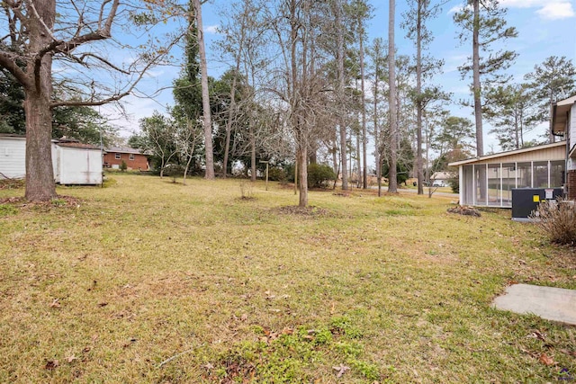 view of yard featuring a sunroom