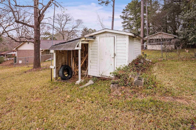 view of outbuilding featuring a lawn