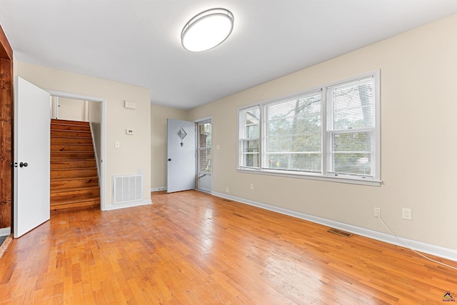 unfurnished room featuring light wood-type flooring