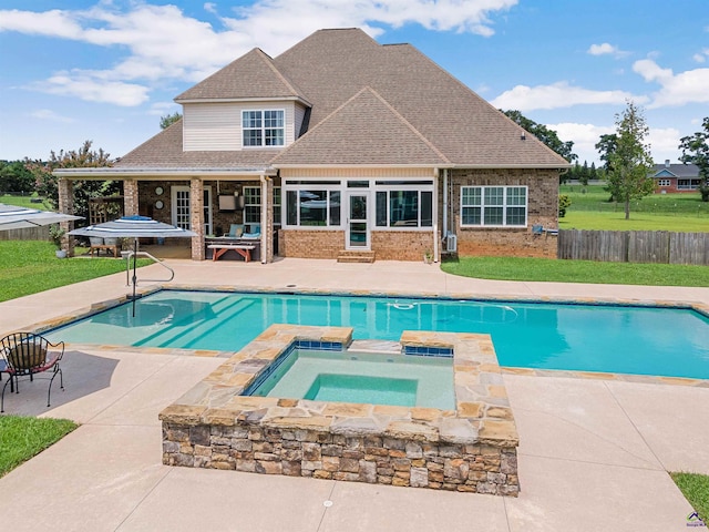 view of pool featuring an in ground hot tub and a patio area