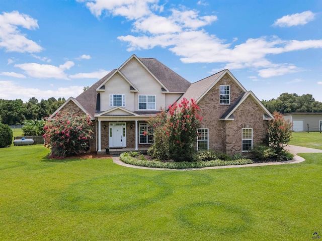 craftsman house featuring a front lawn