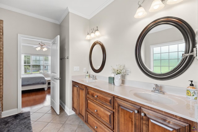 bathroom featuring tile patterned floors, vanity, and crown molding