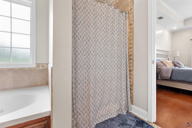 bathroom featuring ornamental molding and wood-type flooring