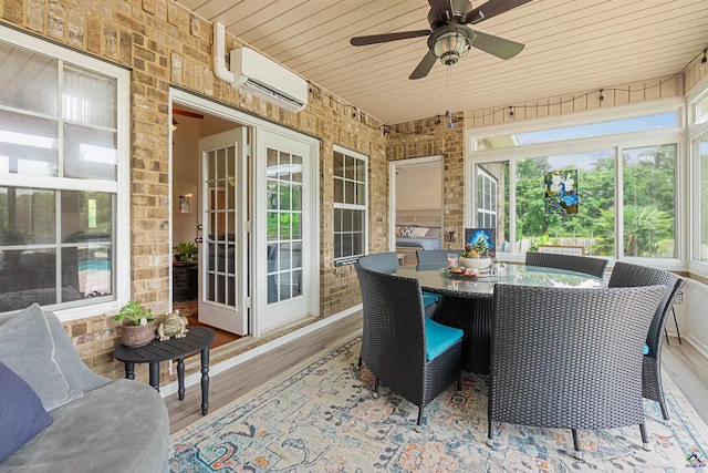 sunroom / solarium with a wall mounted AC and ceiling fan