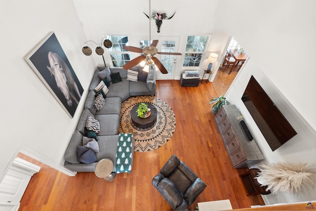 living room with hardwood / wood-style flooring and ceiling fan