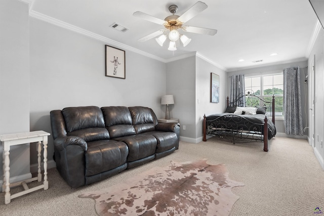 carpeted bedroom with ceiling fan and crown molding