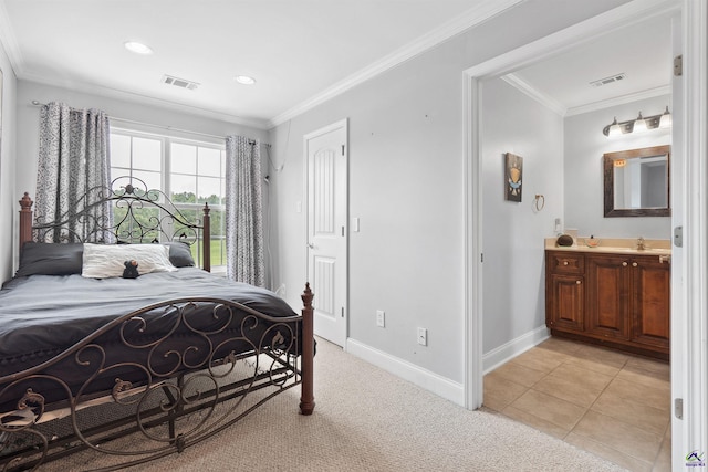 bedroom featuring sink, ornamental molding, and light tile patterned flooring