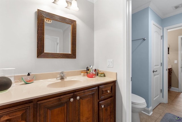 bathroom featuring tile patterned floors, vanity, ornamental molding, and toilet