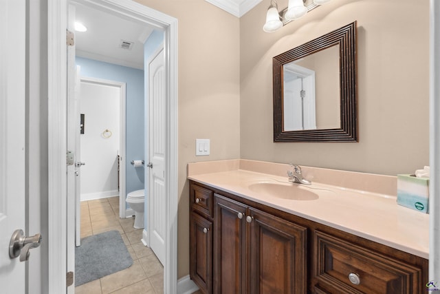 bathroom featuring vanity, toilet, tile patterned floors, and ornamental molding