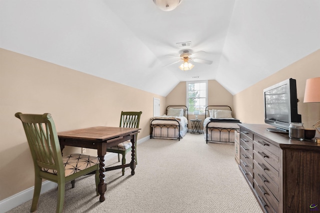 bedroom featuring light colored carpet and lofted ceiling