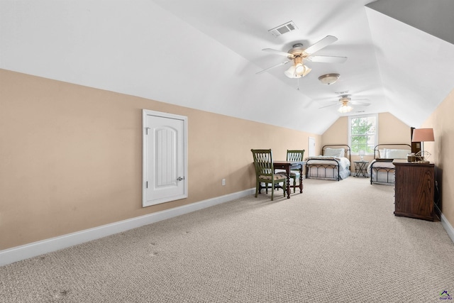 bedroom with vaulted ceiling and carpet