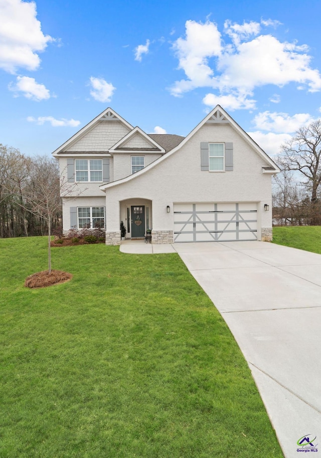 view of front facade featuring a garage and a front lawn