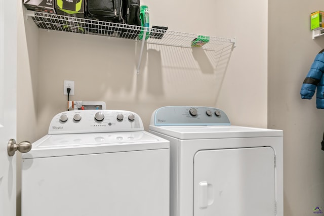 laundry area with washing machine and dryer