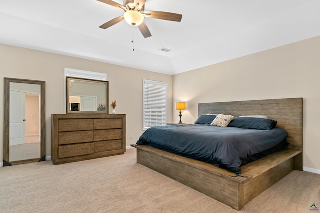 bedroom with light carpet and ceiling fan