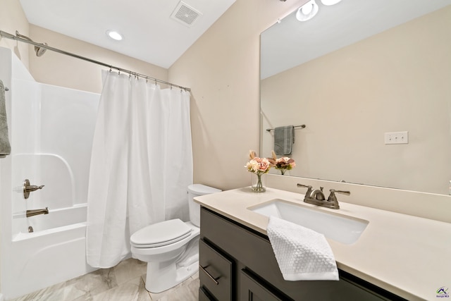 full bathroom featuring shower / bath combo with shower curtain, toilet, and vanity