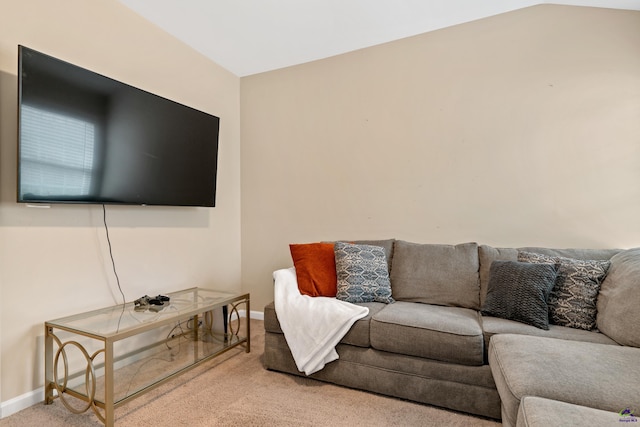 carpeted living room featuring lofted ceiling