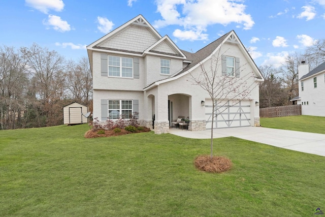 view of front facade featuring a storage shed, a garage, and a front lawn