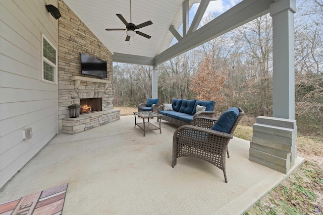 view of patio / terrace with an outdoor living space with a fireplace