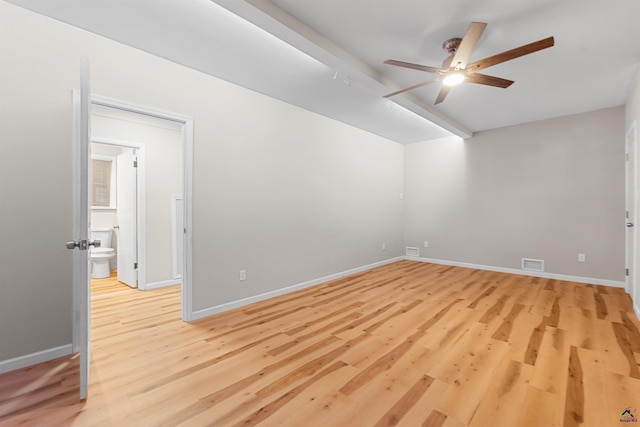 spare room featuring light wood-type flooring and ceiling fan