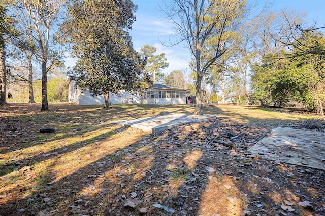 view of yard with a sunroom