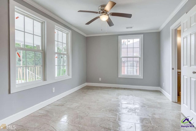 spare room with crown molding and ceiling fan