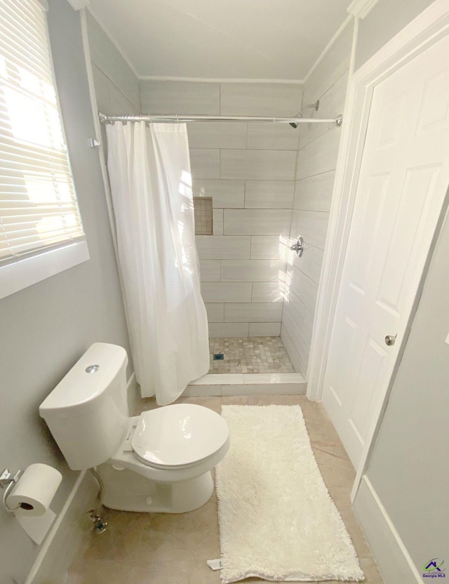 bathroom with walk in shower, toilet, and tile patterned flooring